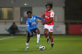 Nathanael Ogbeta of Peterborough United in action with Promise Omochere of Fleetwood Town. Photo: Joe Dent/theposh.com.