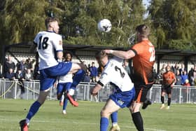 Joint Peterborough Sports manager Michael Gash (orange) battles for the ball against Banbury. Photo: David Lowndes.