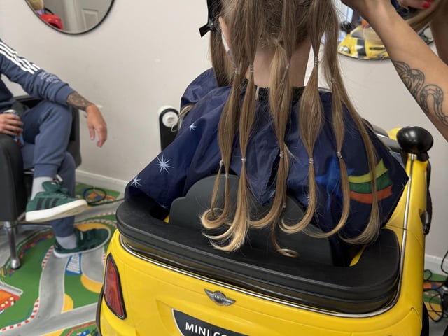 Tom Butler (3) of Peterborough has his haircut by Erica for the Little Princess Trust