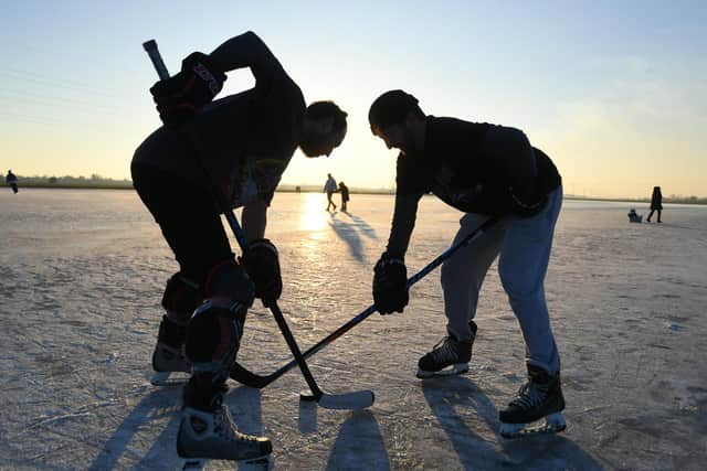 Ice Skating at Whittlesey Wash. Ice hockey players  Ben Livermore and Ryan Kemp
