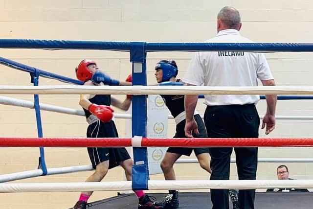 Jacob Hussain (blue headguard) on the attack.