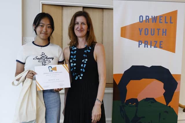 Ruxue Jia receiving her prizes, from Orwell Foundation Deputy Director Elizabeth Wallace