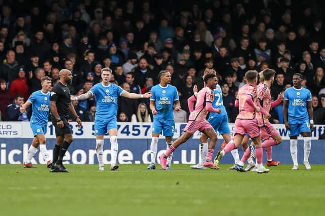 Posh defender Josh Knight leads the complaints after Leeds United score their first goal. Photo: Joe Dent/theposh.com.
