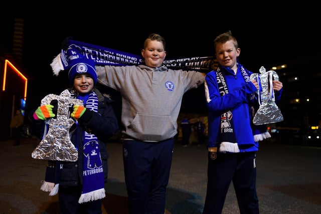 Fans pose with tin foil fa cups outside the stadium before the Emirates FA Cup fourth round replay match between Peterborough United and West Bromwich Albion in 2016.
