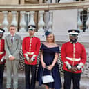 Peterborough's Up The Garden Bath's Dave Poulton and daughter Sienna Hayes-Palmer with Guards at the Royal Garden Party