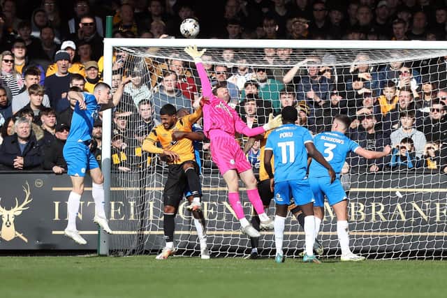 Jed Steer makes a save against Cambridge. Photo: Joe Dent.
