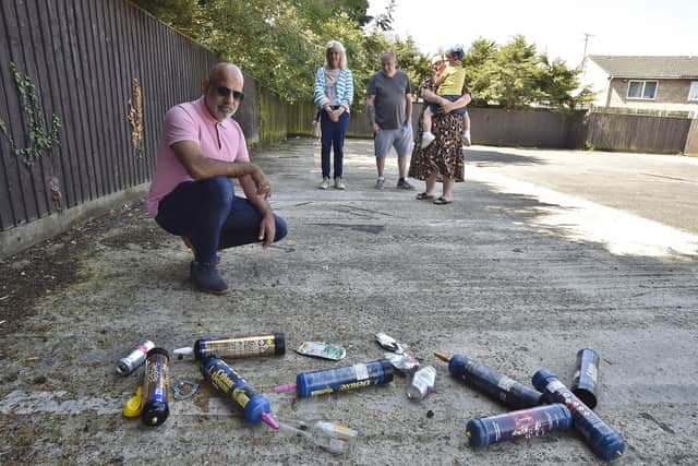 Ishy Hussain with residents at Figtree Walk where their car park has been vandalised and used for anti-social behaviour.