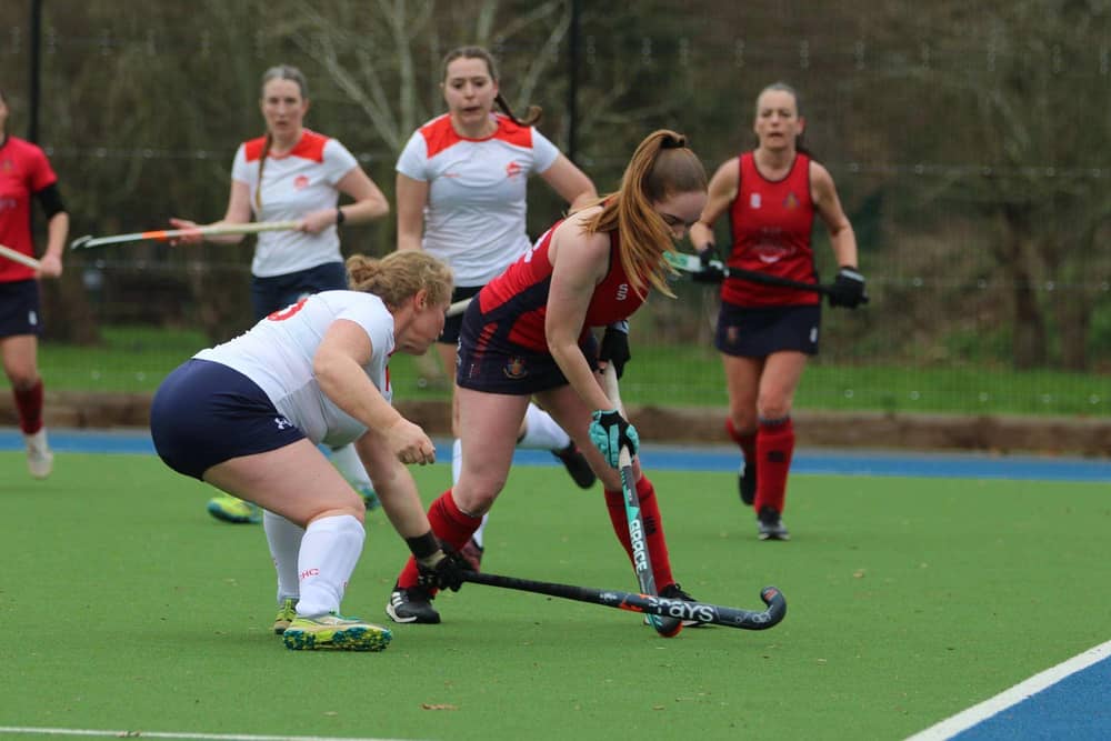 Wisbech Ladies seconds (red) in action against City of Peterborough 4ths. Photo Tim Chapman