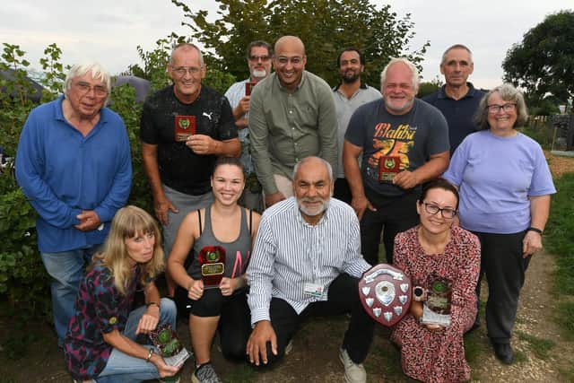 City councillor Ansar Ali presenting trophies to the winners of the annual competition at the Wesleyan Road allotments during happier times.