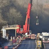 The footbridge being removed over the Nene Parkway.