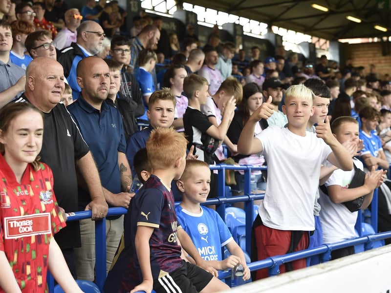 Peterborough United fans watch the draw with Leyton Orient.
