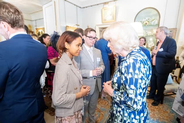 Thomas Deacon Academy students James Bryant and Aleesha Mbye chatting with the Queen Consort.