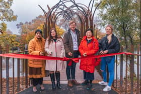Nene Park staff and volunteers were joined by community leaders for the bridge's ribbon-cutting ceremony.