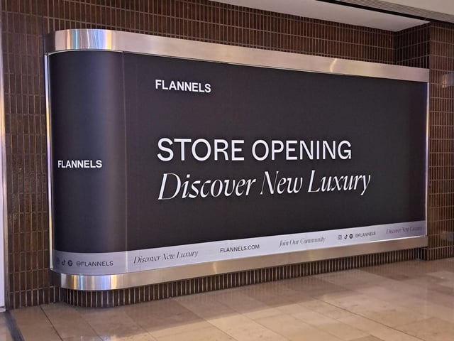 New signage at Peterborough's Queensgate Shopping Centre show that Flannels, a clothing brand owned by the Frasers Group, is on its way to the city.