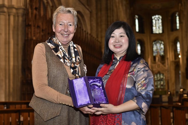 Lord Lt. Julie Spence with Faustina Yang receiving the King's Award for Voluntary Services at Peterborough Cathedral.