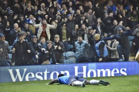 Kwame Poku just after his knee slide to celebrate putting Posh 3-0 up against Sheffield Wednesday. Photo: Joe Dent.