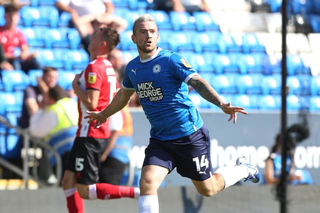 Jack Marriott of Peterborough United celebrates his second and his side's fourth goal of the game against Lincoln.-Photo: Joe Dent/theposh.com.