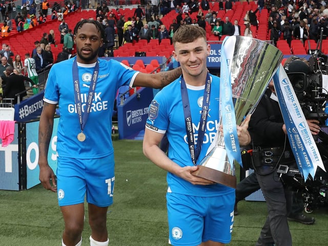 Harrison Burrows with the EFL Trophy and his great mate Ricky-Jade Jones.