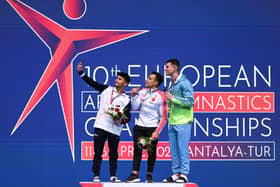 Jake Jarman (left) celebrates a silver medal at the 2023 European Championships. Photo by OZAN KOSE/AFP via Getty Images.