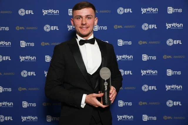 Harrison Burrows with his League One player of the year prize. Photo courtesy of the EFL.