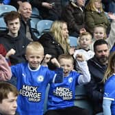 Peterborough United fans watch the defeat against Bolton Wanderers on 11th Feb 2023.