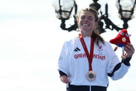 Lauren Steadman with her Paralympic bronze medal from the 2024 Games in Paris. Photo by ALAIN JOCARD/AFP via Getty Images.