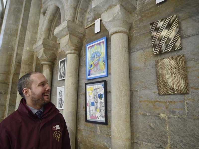 Made in Peterborough art exhibition at Peterborough Cathedral. Cathedral welcomer Sefton Thornton-Lewis with his wood burning art