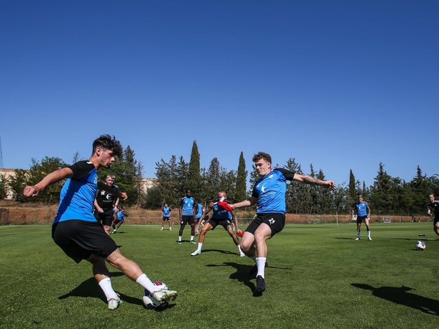 Joel Randall on the ball with Ben Thompson to his right.
