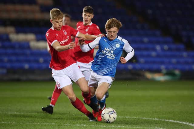 Recent Peterborough Sports signing Will Van Lier (blue), Photo Joe Dent/theposh.com