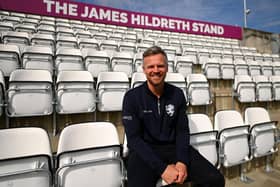 James Hildreth poses in front of the stand at Somerset's Taunton cricket ground which bears his name. (Photo by Harry Trump/Getty Images)