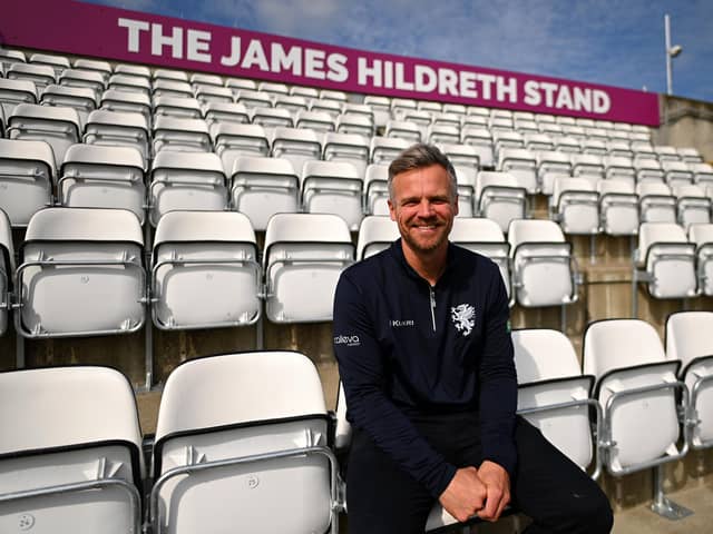James Hildreth poses in front of the stand at Somerset's Taunton cricket ground which bears his name. (Photo by Harry Trump/Getty Images)