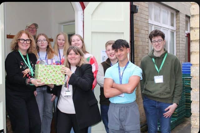 Year 12 students with Head of Sixth Form, Samantha Moore from Ramsey Gatehouse Sixth Form, deliver donations to Ramsey Foodbank.