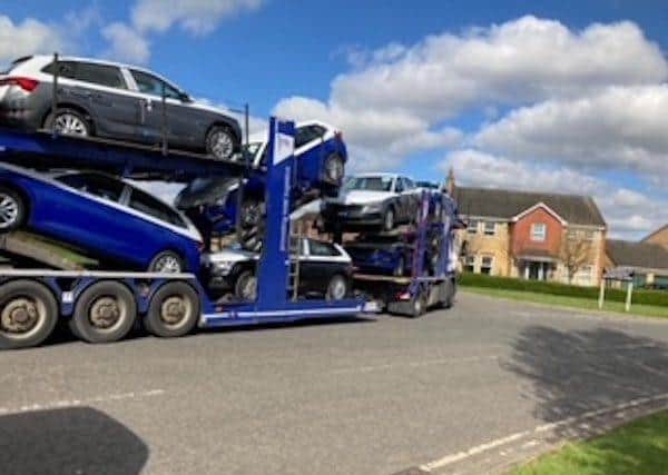 Car transporters entering Dunblane Drive in Peterborough.