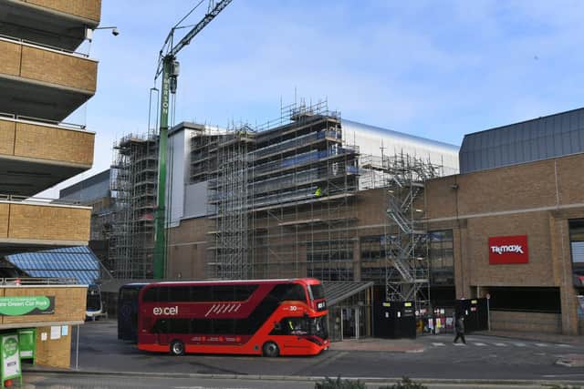 New retailers are moving into the Queensgate shopping centre in Peterborough as work construction work continues on a 10-screen Empire cinema.
