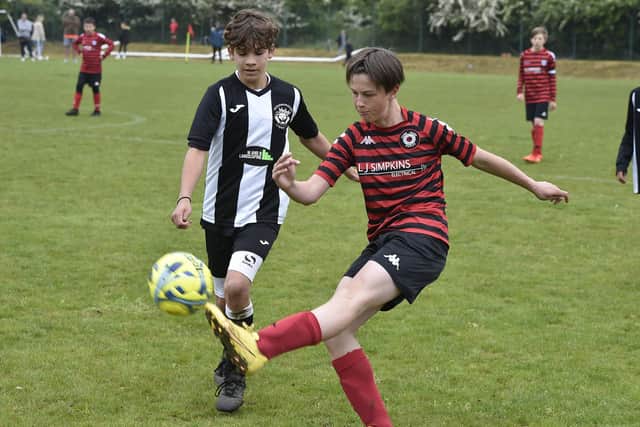 Action from Park Farm Pumas v Peterborough Lions (black and white) in the Under 12 Hereward Cup Final. Photo: David Lowndes.