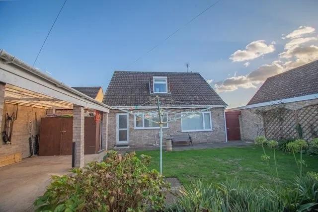 The property has a garden to the front and rear and a car port