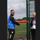 Jonson Clarke-Harris cuts the ribbon on the new 3G pitch at St John Fisher Catholic school.