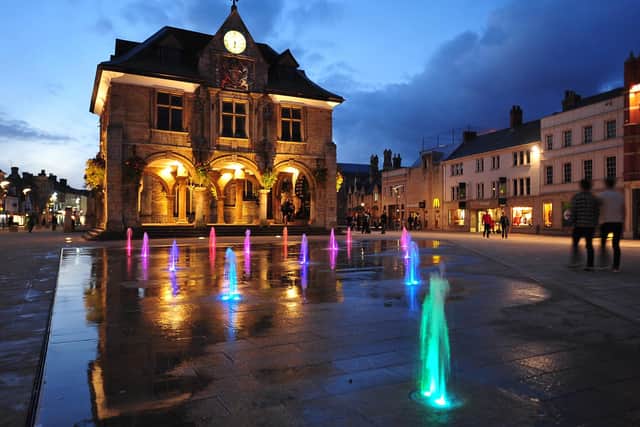 The fountains in Cathedral Square, Peterborough, are a colourful attraction.