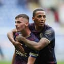 Harrison Burrows (left) and Romoney Crichlow of Peterborough United embrace at full-time at Reading, Photo: Joe Dent/theposh.com.