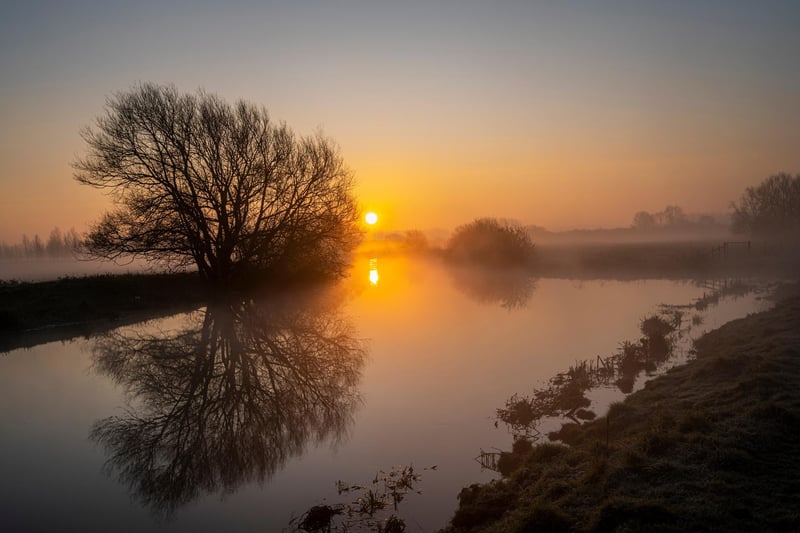This haunting shot of a misty sunrise topping the Nene at Fotheringhay captures the river's timeless beauty.