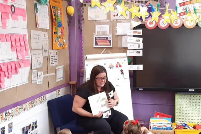 Cllr Katy Cole reading to children at Newark Hill Academy
