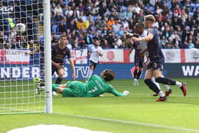 Victor Adeboyejo scores for Bolton v Posh. Photo by Paul Currie/Shutterstock.