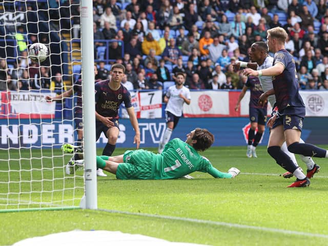 Victor Adeboyejo scores for Bolton v Posh. Photo by Paul Currie/Shutterstock.