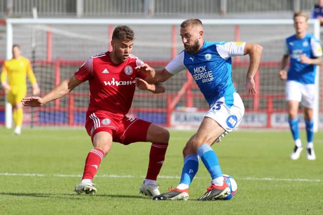 Dion Charles of Accrington Stanley in action against Dan Butler of Posh on the opening day of the 2020-21 League One season. Photo: Joe Dent/theposh.com.