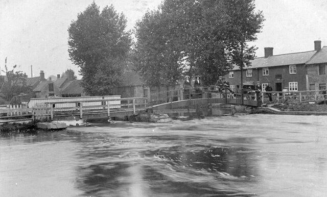 A dangerously swollen River Welland at Deeping St James Locks (Peterborough Images Archive)