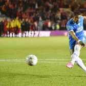 Jonson Clarke-Harris powers home his penalty in Tuesday night's dramatic Carabao Cup shootout success against Swindon. Photo: David Lowndes.