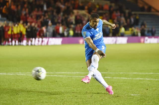Jonson Clarke-Harris powers home his penalty in Tuesday night's dramatic Carabao Cup shootout success against Swindon. Photo: David Lowndes.