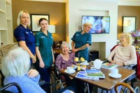 Residents and colleagues enjoying a coffee morning experience.