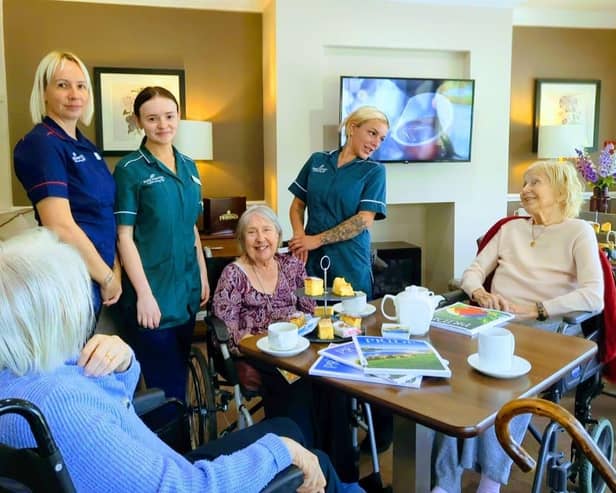 Residents and colleagues enjoying a coffee morning experience.