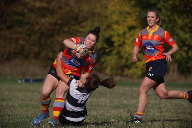 Cheryl Smith (with ball) in action for PRUFC Ladies. Photo Philip Lindhurst.